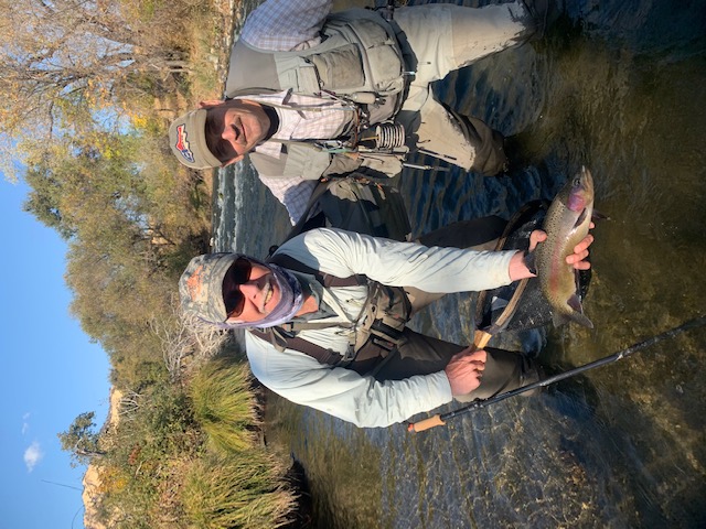 Client and Richard holding a rainbow trout